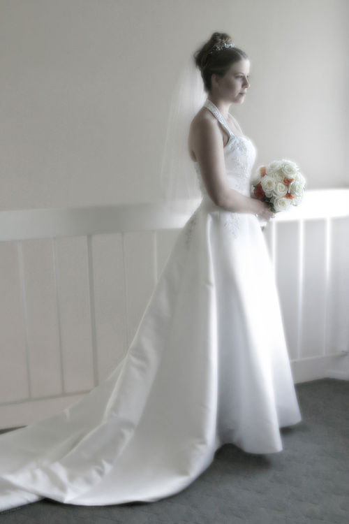 A bride in a white wedding gown — bridal alterations